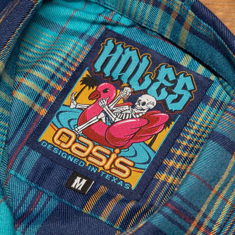 Close-up of a colorful patch on a plaid fabric background